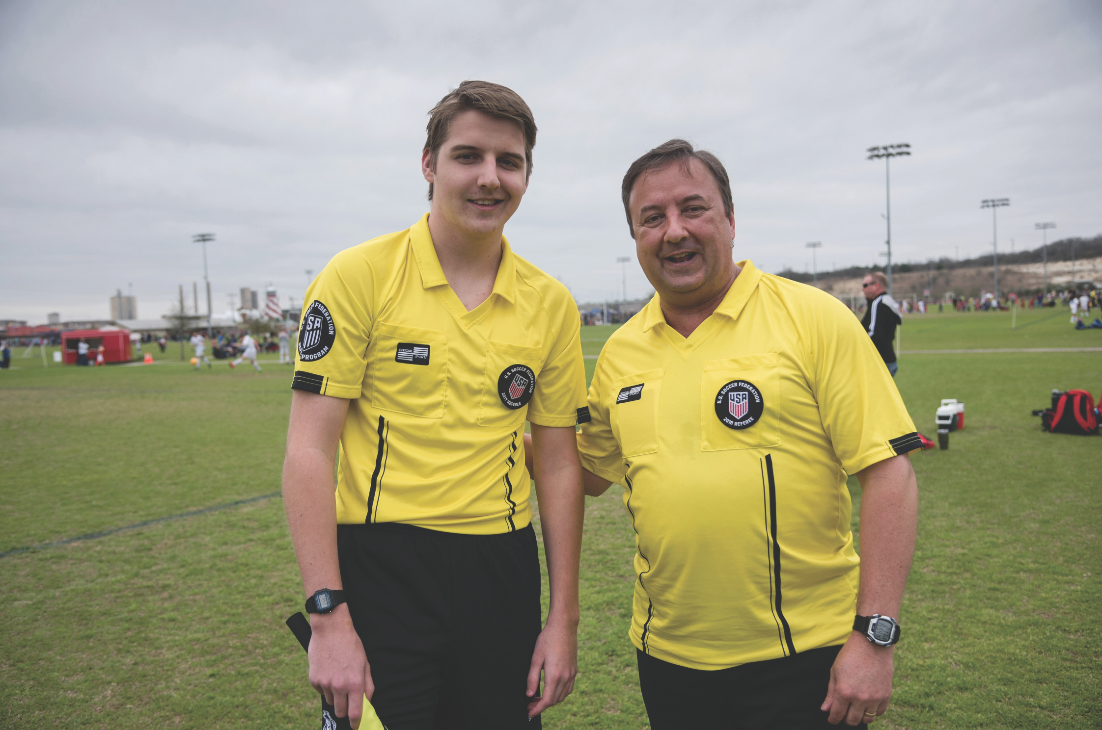 Michael Parker (right) and his son Zachary are involved with youth soccer and referee games on weekends.